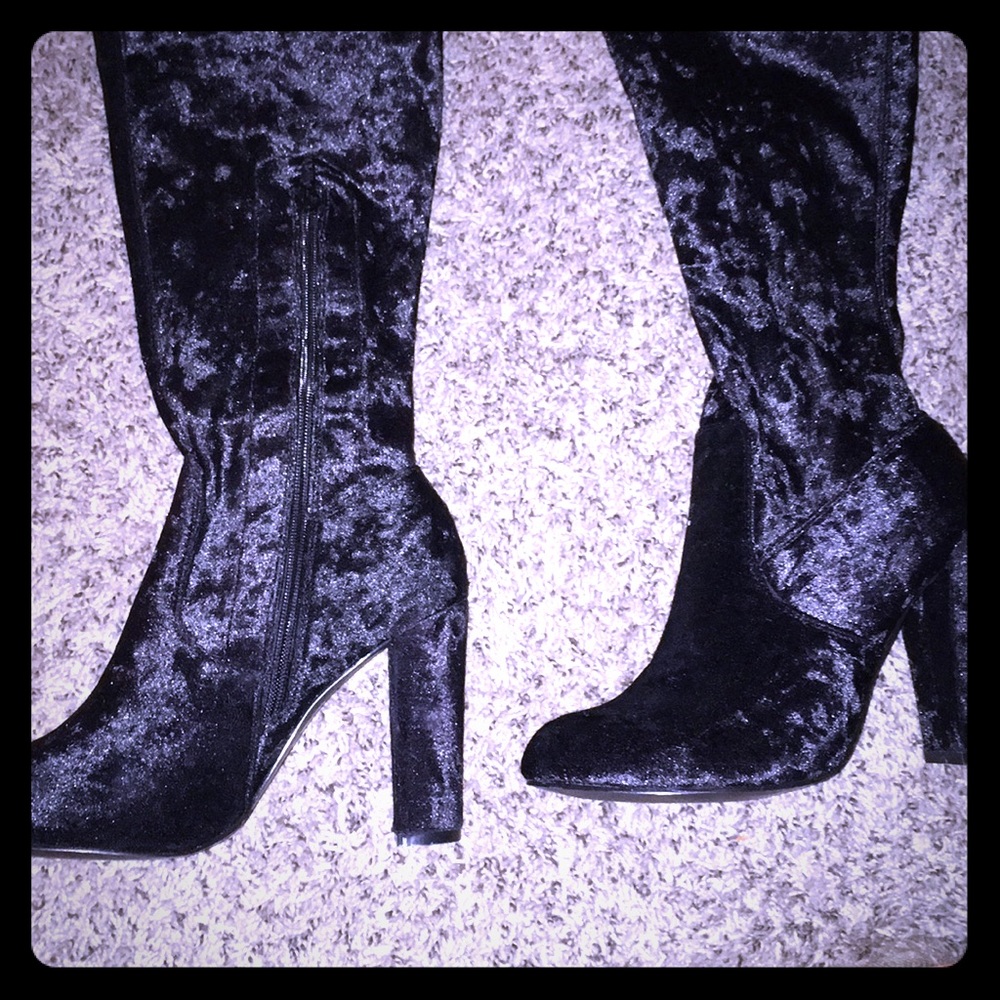 Black velvet knee high heeled boots